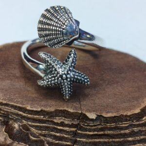 Anello Contrarie stella e conchiglia