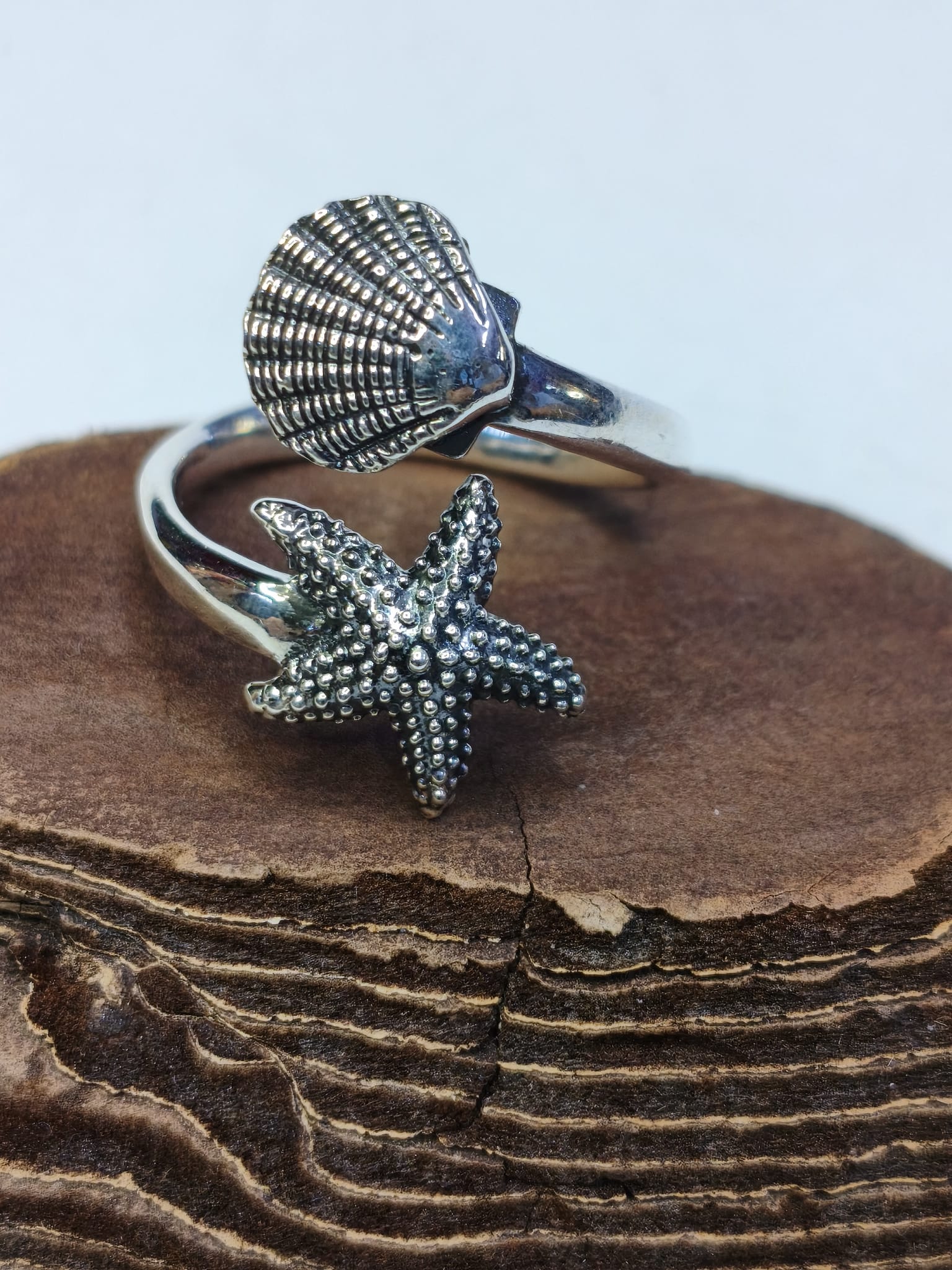 Anello Contrarie stella e conchiglia